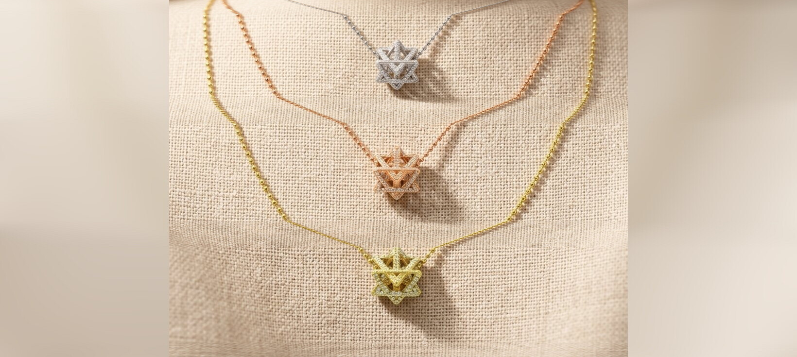 Layered Merkabah Star of David diamond necklaces in 14K white, rose, and yellow gold